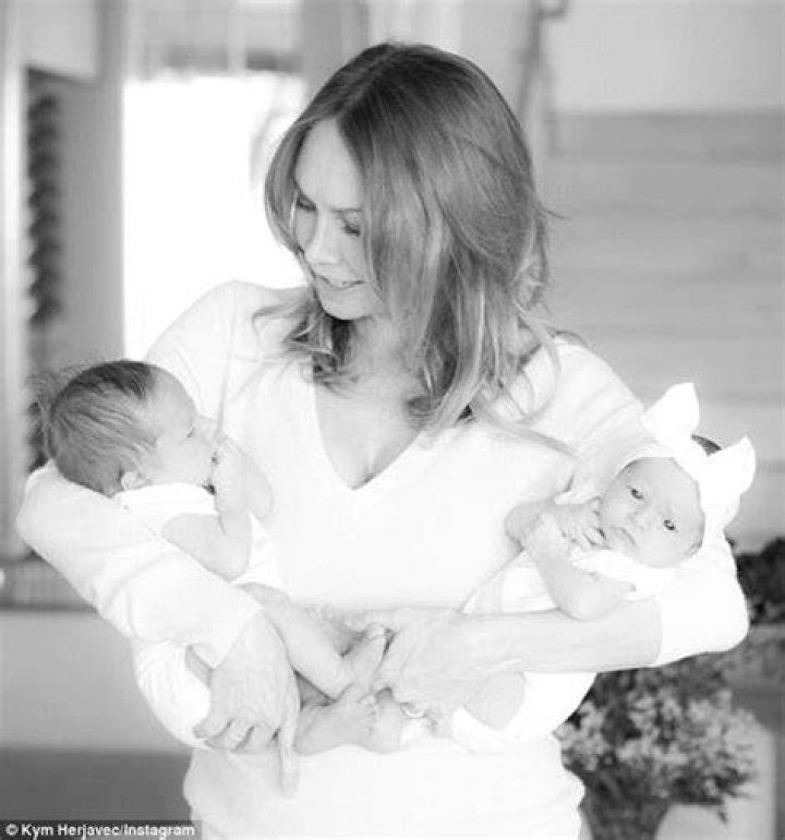 How old are Kym Johnson’s twins?