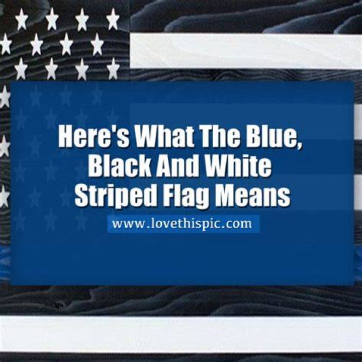 What does a black and white striped American flag with a blue stripe mean?